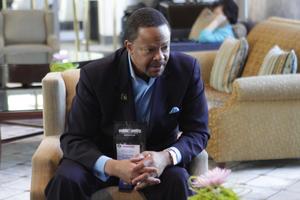 Primary view of object titled '[Dr.Rod Fluker in lounge at 2012 TABPHE conference]'.