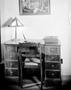 Primary view of [Photograph of a wooden desk and chair]