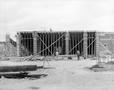 Photograph: [Photograph of workers building a stadium]