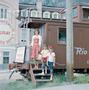Primary view of [Carol, Pam and Byrd posing nect to a railroad car]