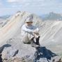Photograph: [A man sitting on a mountain]