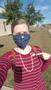 Primary view of [Stefanie Skogen wearing a face mask and "I voted" sticker]