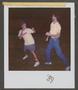 Photograph: [Byrd Williams V and  another man play fighting]