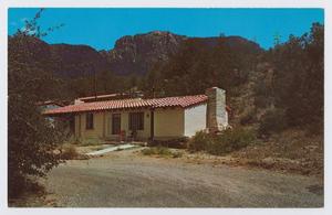 Primary view of object titled '[Postcard of a Chisos Mountain cottage]'.