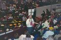 Photograph: [Crowd and standing man at 1994 Texas Democratic Convention]