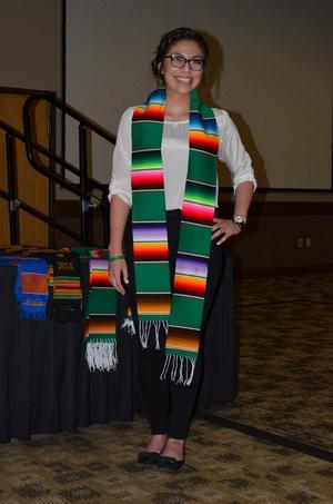Primary view of object titled '[Student wearing serape stole and white shirt]'.