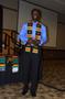 Photograph: [Young man with Kente stole, MC ceremony]