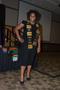 Primary view of [Young woman wearing Kente stole, MC ceremony]