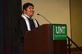Photograph: [Graduating student speaking at UNT ceremony]