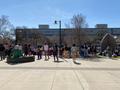 Photograph: [Crowd and Sister Cindy outside UNT Union]