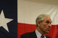 Thumbnail image of item number 1 in: '[Portrait of Ron Paul in front of Texas flag at campaign rally]'.
