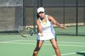 Photograph: [Idalina Franca swings racket during tennis match]