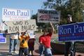 Photograph: [Photograph of a group holding Ron Paul signs on the Square 5]