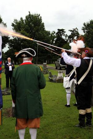 Primary view of object titled '[Color Guard performs musket salute during grave marking ceremony for C. B. Dorchester, 3]'.