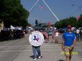Photograph: [Roger Wehr carries TXSSAR sign at 2015 Arlington 4th of July Parade]