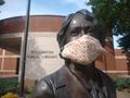 Photograph: [Stillwater Public Library's bronze statue of Angie Debo wearing a cl…