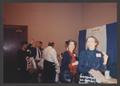 Photograph: [People visiting booths at a conference]