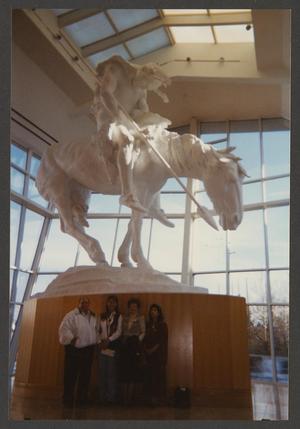 Primary view of object titled '[Four individuals at the National Cowboy & Western Heritage Museum]'.