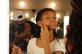 Photograph: [Girl applies stage makeup at 2016 TBAAL Summer Youth Arts Institute]