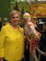 Photograph: [Gretchen Bataille poses with Thai puppet, 1]