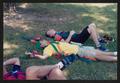Photograph: [Partners laying in the grass together: Lone Star Ride 2002 event pho…