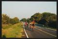 Primary view of [Clump of cyclists in the late afternoon light: Lone Star Ride 2002 event photo]