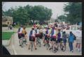 Photograph: [A group of cyclists in matching jerseys in a parade: Lone Star Ride …