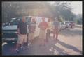 Photograph: [Group by parked vans: Lone Star Ride 2004 event photo]