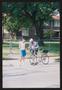 Photograph: [A cyclist stopped to talk to another man: Lone Star Ride 2004 event …