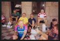 Primary view of [Cyclists sitting and talking on the patio of the Wise county courthouse: Lone Star Ride 2001 event photo]