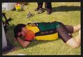 Photograph: [Cyclist taking a nap on the grass: Lone Star Ride 2001 event photo]