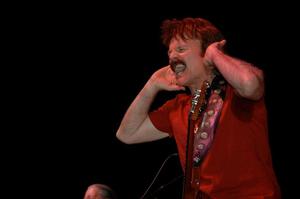 Primary view of object titled '[Tom Johnston yells on stage, closeup]'.