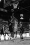 Photograph: [UNT women's basketball player attempts to shoot ball during Troy gam…