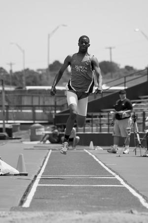 Primary view of object titled '[LeBoyd Clewis performs triple jump at Brooks/NT Spring Classic, 1]'.