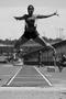 Primary view of [Ronniqua Wilson performs long jump at Mean Green Twilight Invitational]