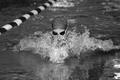 Photograph: [UNT swimming and diving member performs breaststroke at Air Force ga…