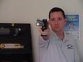 Photograph: [Steve Swartz poses with air pistol, 5]