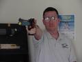 Photograph: [Steve Swartz poses with air pistol, 2]