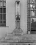 Primary view of [An art deco style column in front of a building]
