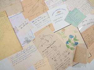 Primary view of object titled '[Closeup of a collection of assorted handwritten notes and drawings]'.