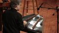 Photograph: [Musician playing a hammered dulcimer at the Percussion Holiday Perfo…