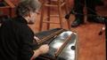 Photograph: [Musician playing a hammered dulcimer at the Percussion Holiday Perfo…