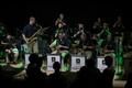 Photograph: [Saxophone and trumpet players performing at the Jazz Ambassadors Syn…