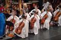 Photograph: [Cellists and violinists performing at the Spooktacular Performance]