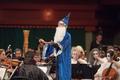 Thumbnail image of item number 1 in: '[Close-up of the Symphony Orchestra conductor dressed as a wizard at the Spooktacular Performance]'.