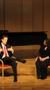 Primary view of [Heggie speaking with interviewer on stage, Student recital during Jake Heggie's residency, 11]