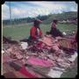 Photograph: [Two Women Selling Clothing at a Market]