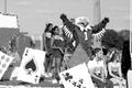 Photograph: [Scrappy with cheerleaders on Homecoming float, 2]