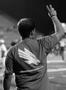 Photograph: [Man does eagle claw at UNT football game]