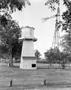 Photograph: [Aermotor windmill and a wooden water tower, 2]